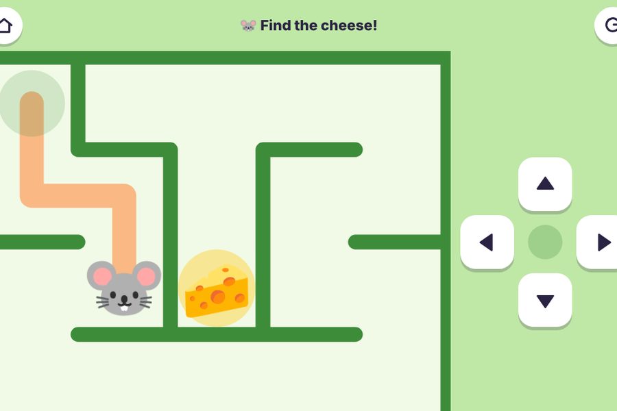 A mouse in a green maze heading for a piece of cheese
